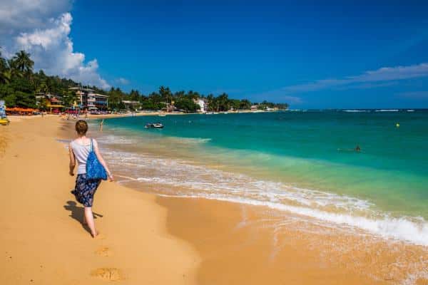 Tourist,Walking,Along,Unawatuna,Beach,,A,Beautiful,Sandy,Beach,On
