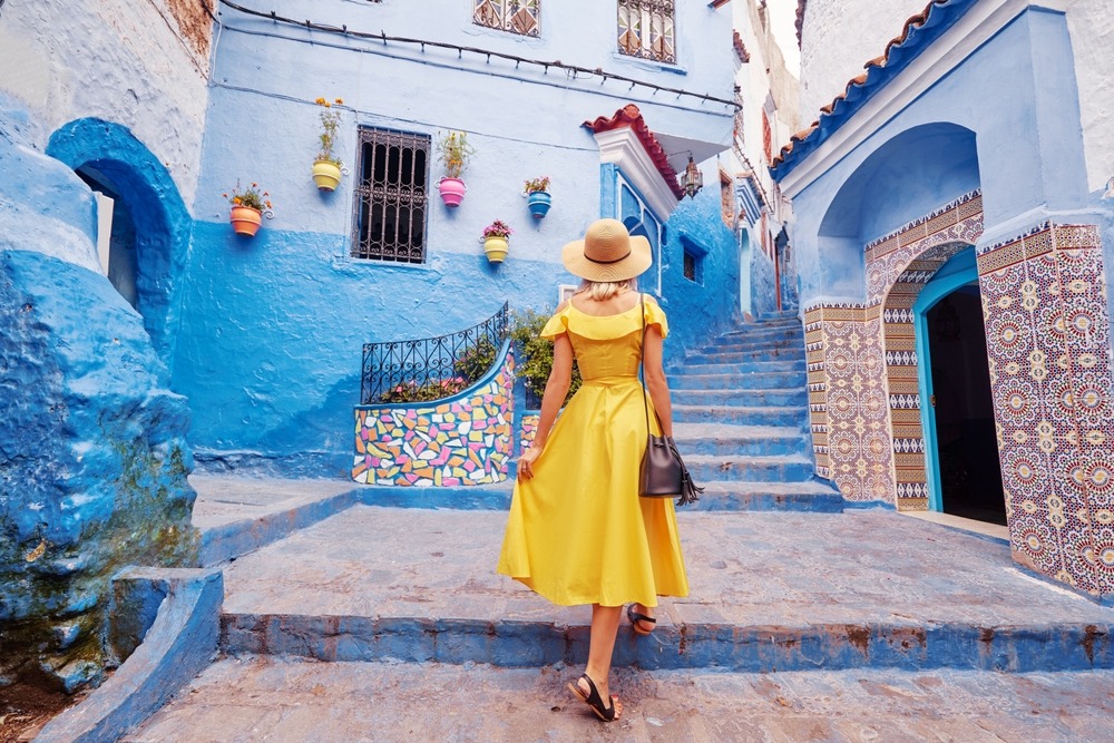 Colorful,Traveling,By,Morocco.,Young,Woman,In,Yellow,Dress,Walking